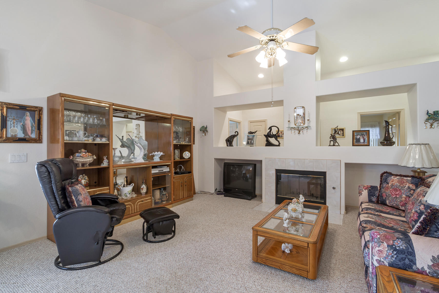 3941 West Charter Oak Road Phoenix, AZ 85029 - Photo 8 of 25 a living room with furniture and a fireplace