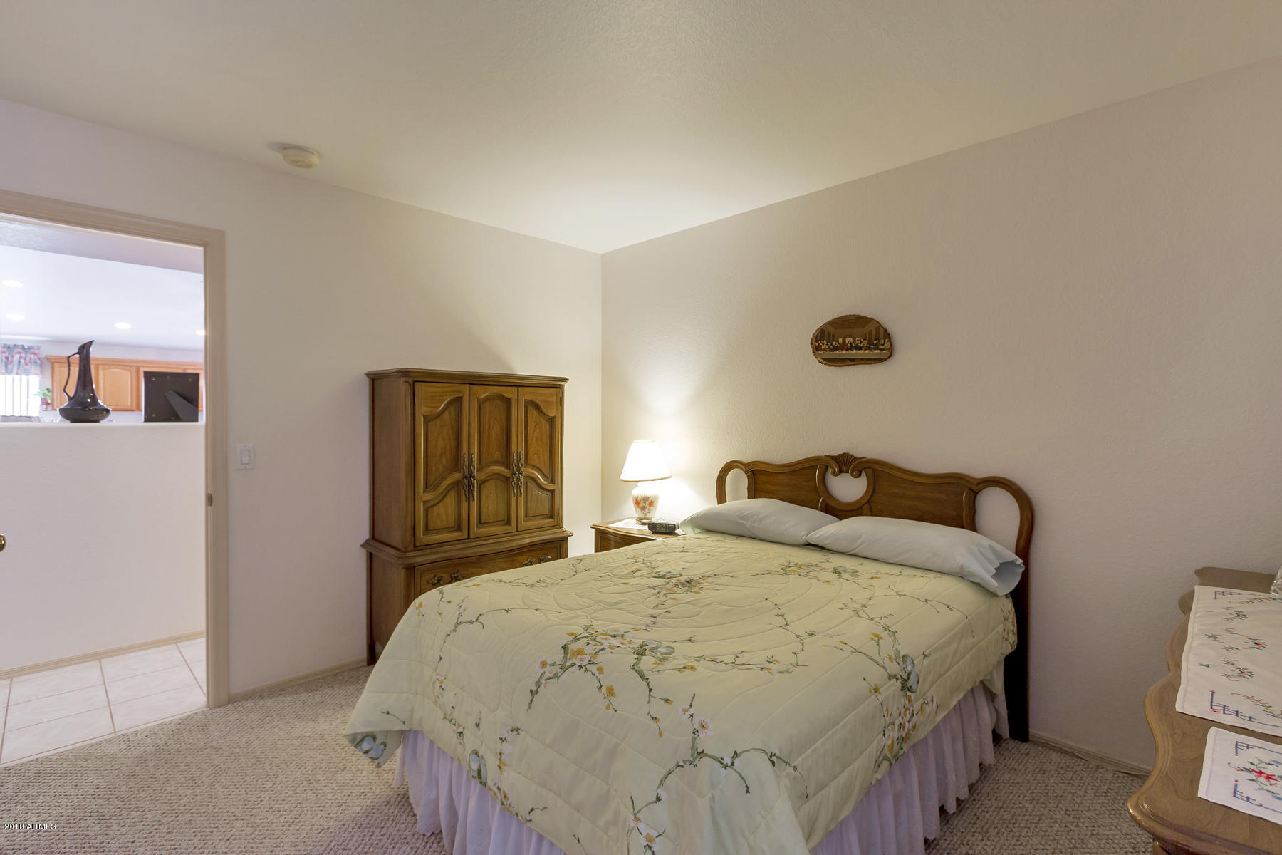 3941 West Charter Oak Road Phoenix, AZ 85029 - Photo 10 of 25 a bedroom with a bed and wooden floor