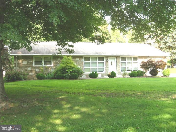 628 Mill Road Trevose, PA 19053 - Photo 1 of 18 a view of a big yard in front of a house