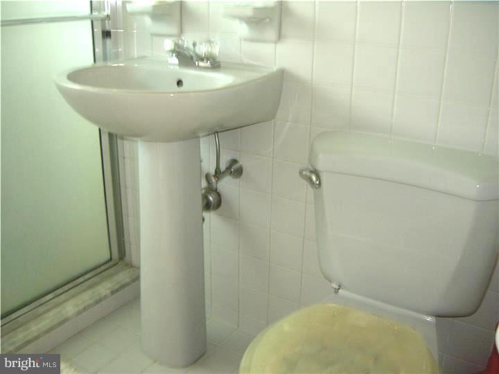 628 Mill Road Trevose, PA 19053 - Photo 14 of 18 a bathroom with a sink and toilet