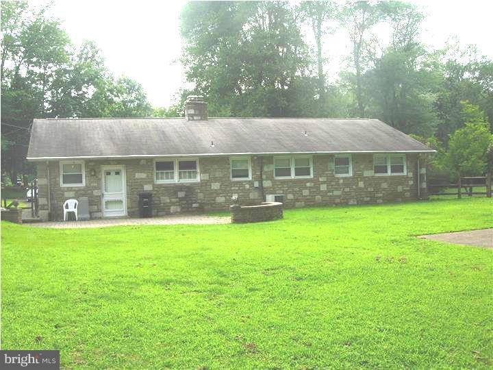 628 Mill Road Trevose, PA 19053 - Photo 4 of 18 a front view of a house with garden