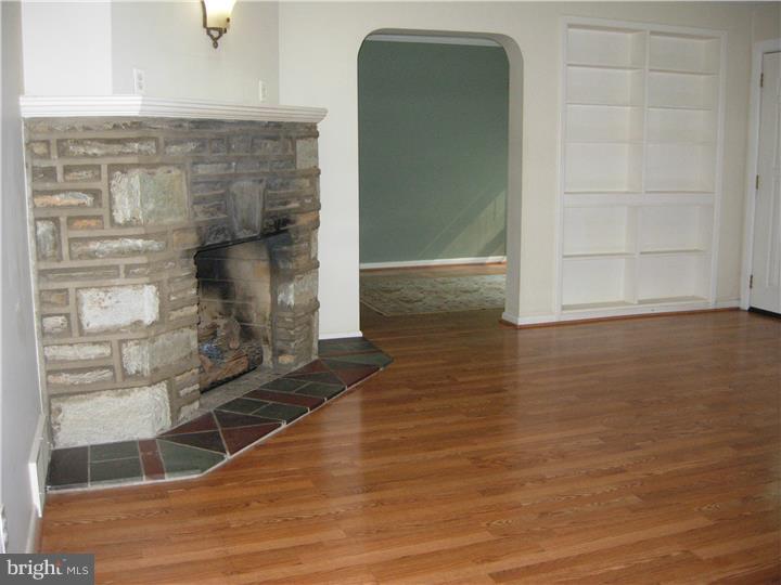 628 Mill Road Trevose, PA 19053 - Photo 6 of 18 a view of empty room with wooden floor