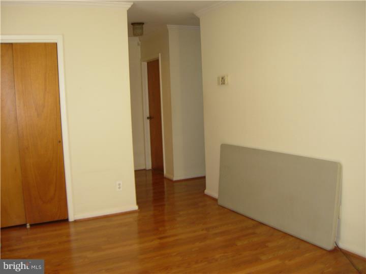 628 Mill Road Trevose, PA 19053 - Photo 7 of 18 a view of an empty room and wooden floor