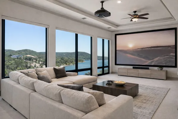 a living room with furniture tv and large window
