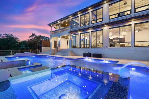 a front view of a house with swimming pool