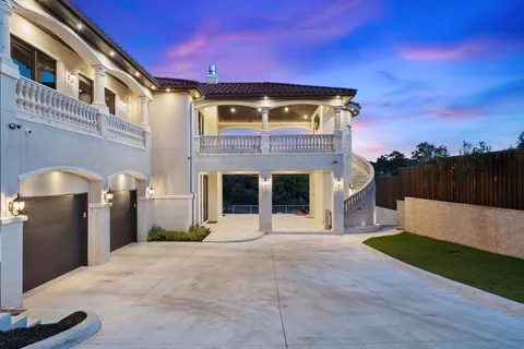 a front view of a house with swimming pool