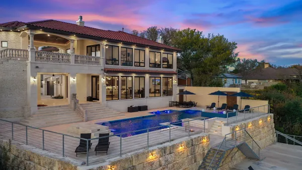a front view of a house with swimming pool