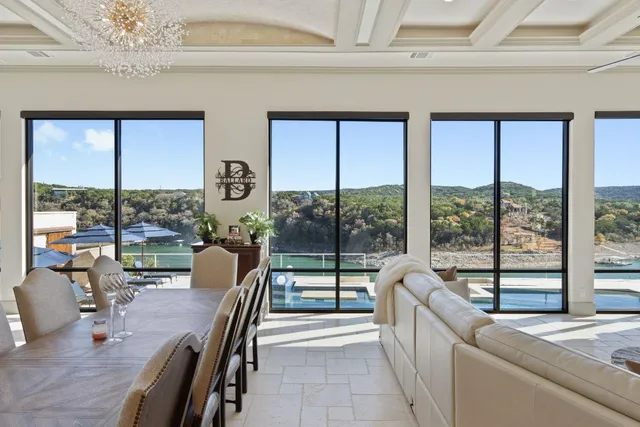 a view of a living room and floor to ceiling window furniture and floor to ceiling window