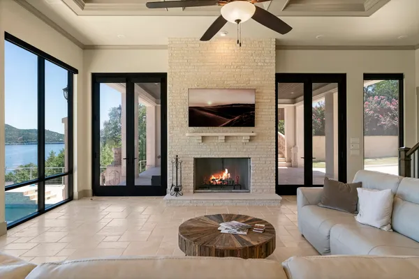 a living room with furniture and a fireplace