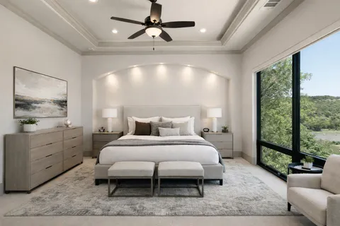 a kitchen with stainless steel appliances granite countertop a sink a stove a refrigerator cabinets and chairs