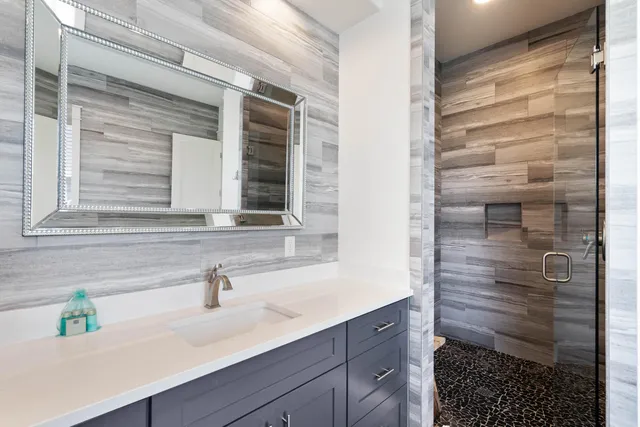 a bathroom with a sink and a mirror