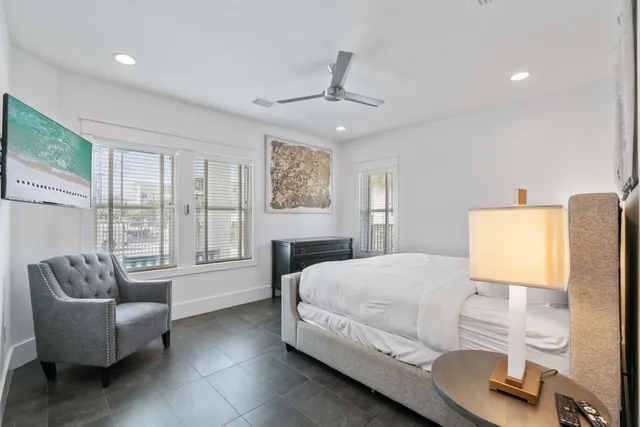 a bedroom with a bed couch and window