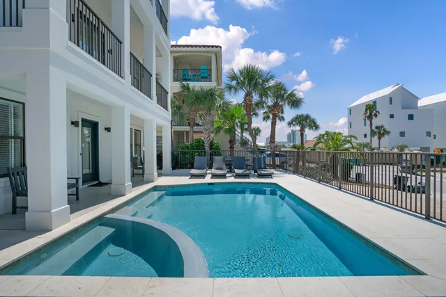 a view of swimming pool with outdoor seating