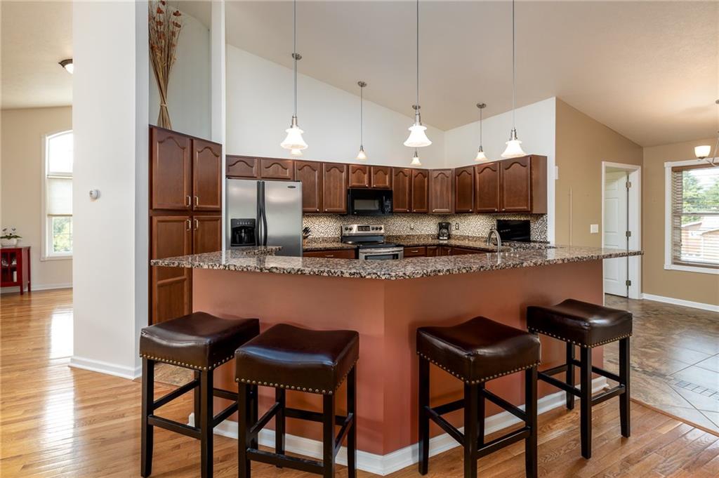 206 McCombs Road Venetia, PA 15367 - Photo 5 of 25 Kitchen with working center island, pendant lights and pub style seating