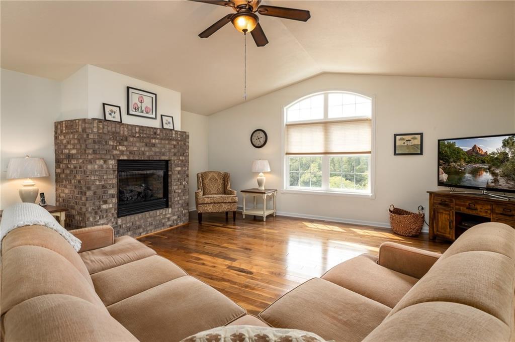 206 McCombs Road Venetia, PA 15367 - Photo 9 of 25 Beautiful rich walnut flooring in family room with brick gas fireplace and plenty of windows for natural lighting