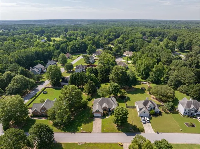 an aerial view of residential houses with outdoor space