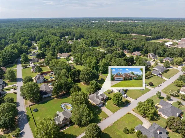 an aerial view of a house with a garden