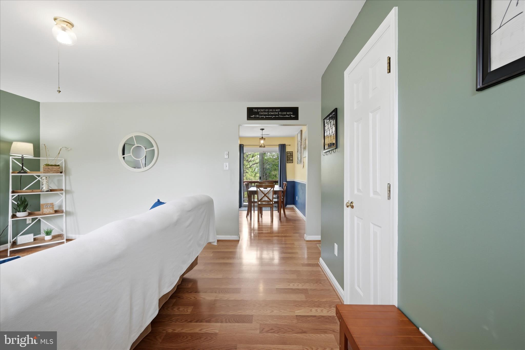 91 Granny Smith Road Linden, VA 22642 - Photo 14 of 65 a view of a hallway with wooden floor and windows