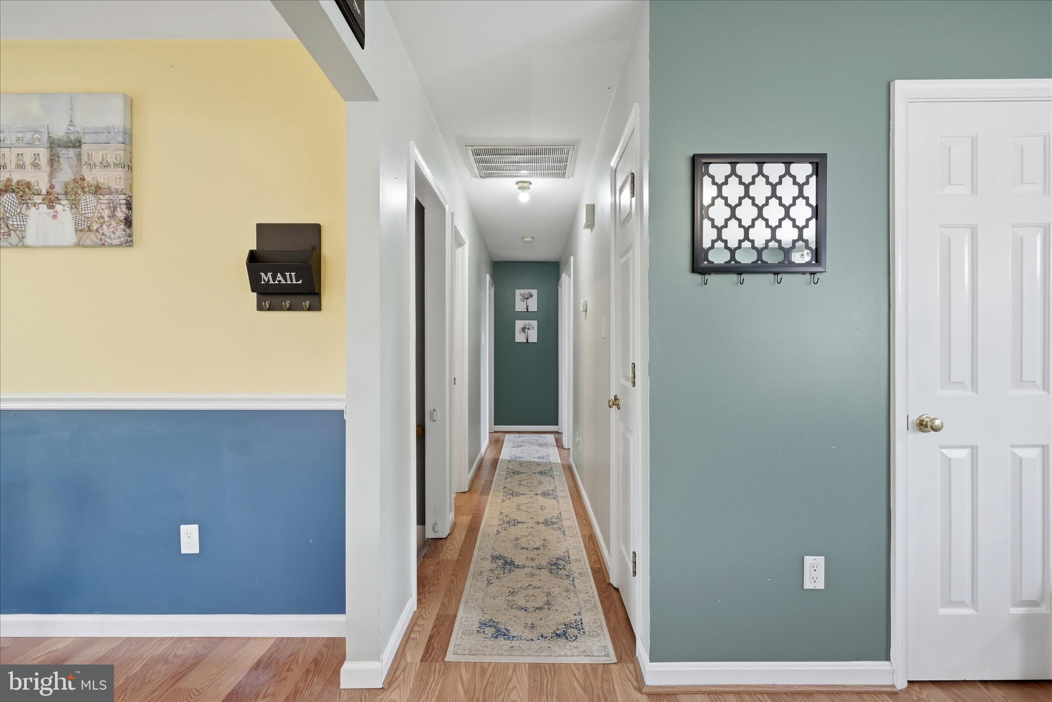 91 Granny Smith Road Linden, VA 22642 - Photo 16 of 65 a view of a hallway with wooden floor and windows