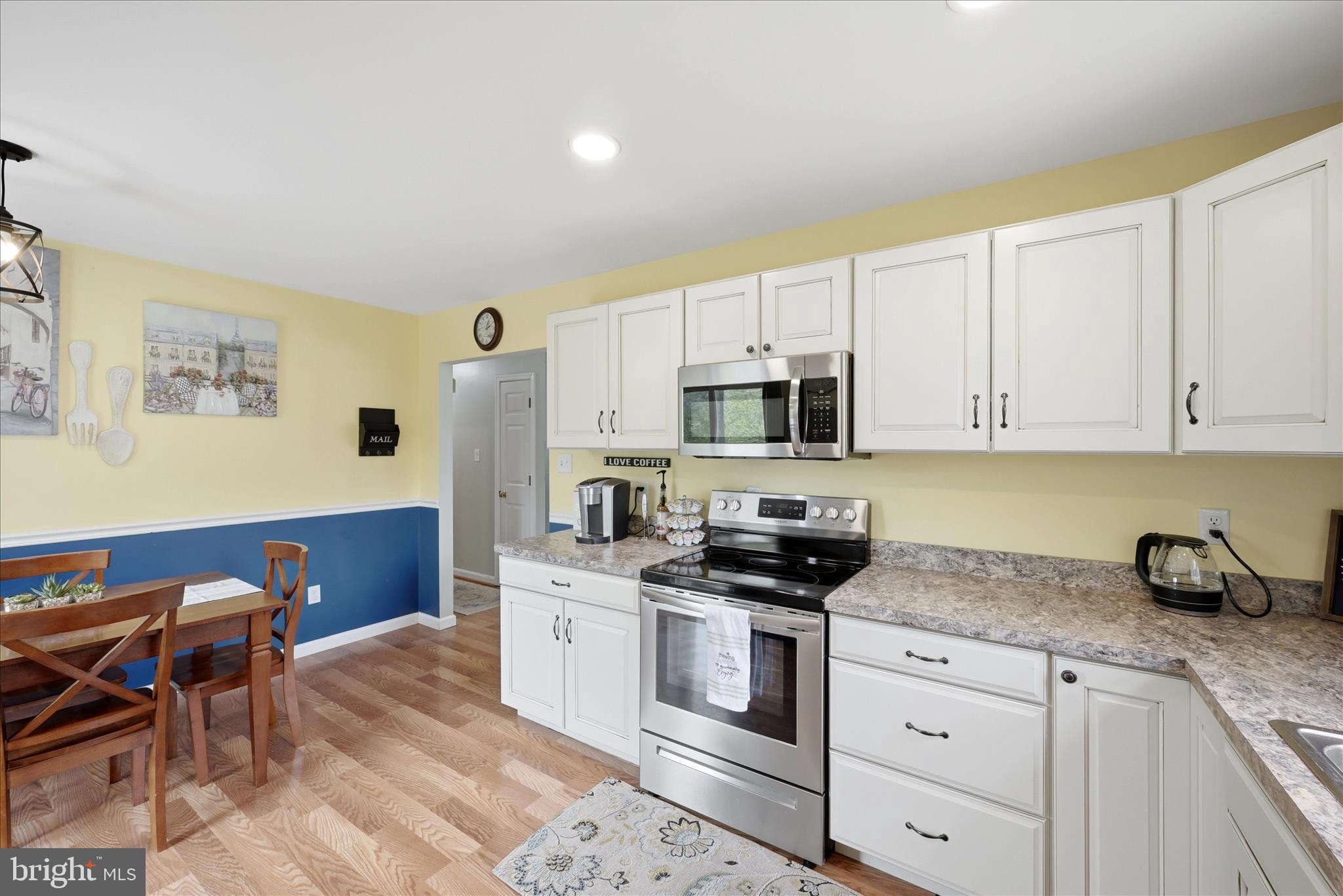 91 Granny Smith Road Linden, VA 22642 - Photo 20 of 65 a kitchen with stainless steel appliances granite countertop a sink stove and cabinets
