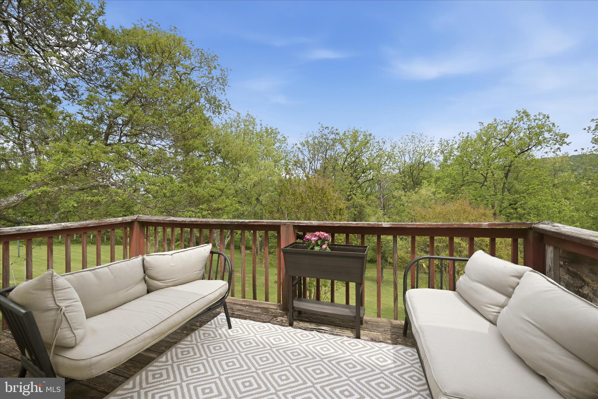 91 Granny Smith Road Linden, VA 22642 - Photo 2 of 65 a balcony with wooden floor and fence