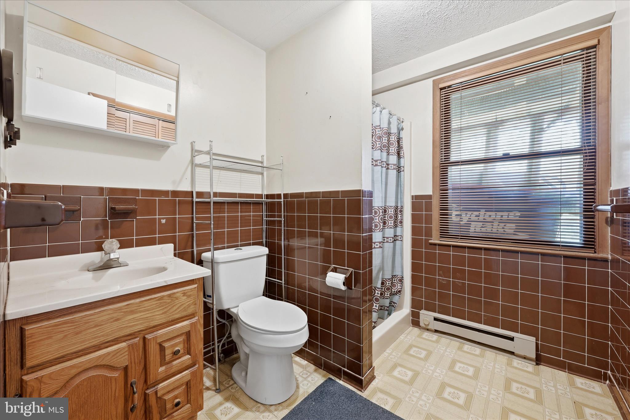 91 Granny Smith Road Linden, VA 22642 - Photo 31 of 65 a bathroom with a toilet a sink and shower