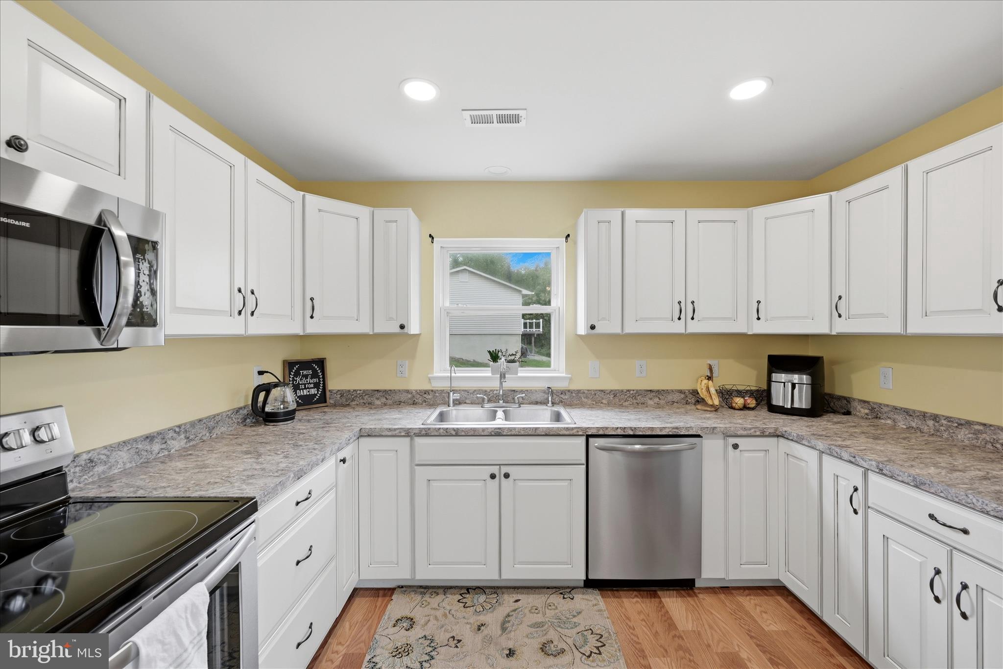 91 Granny Smith Road Linden, VA 22642 - Photo 5 of 65 a kitchen with granite countertop a sink stainless steel appliances and cabinets