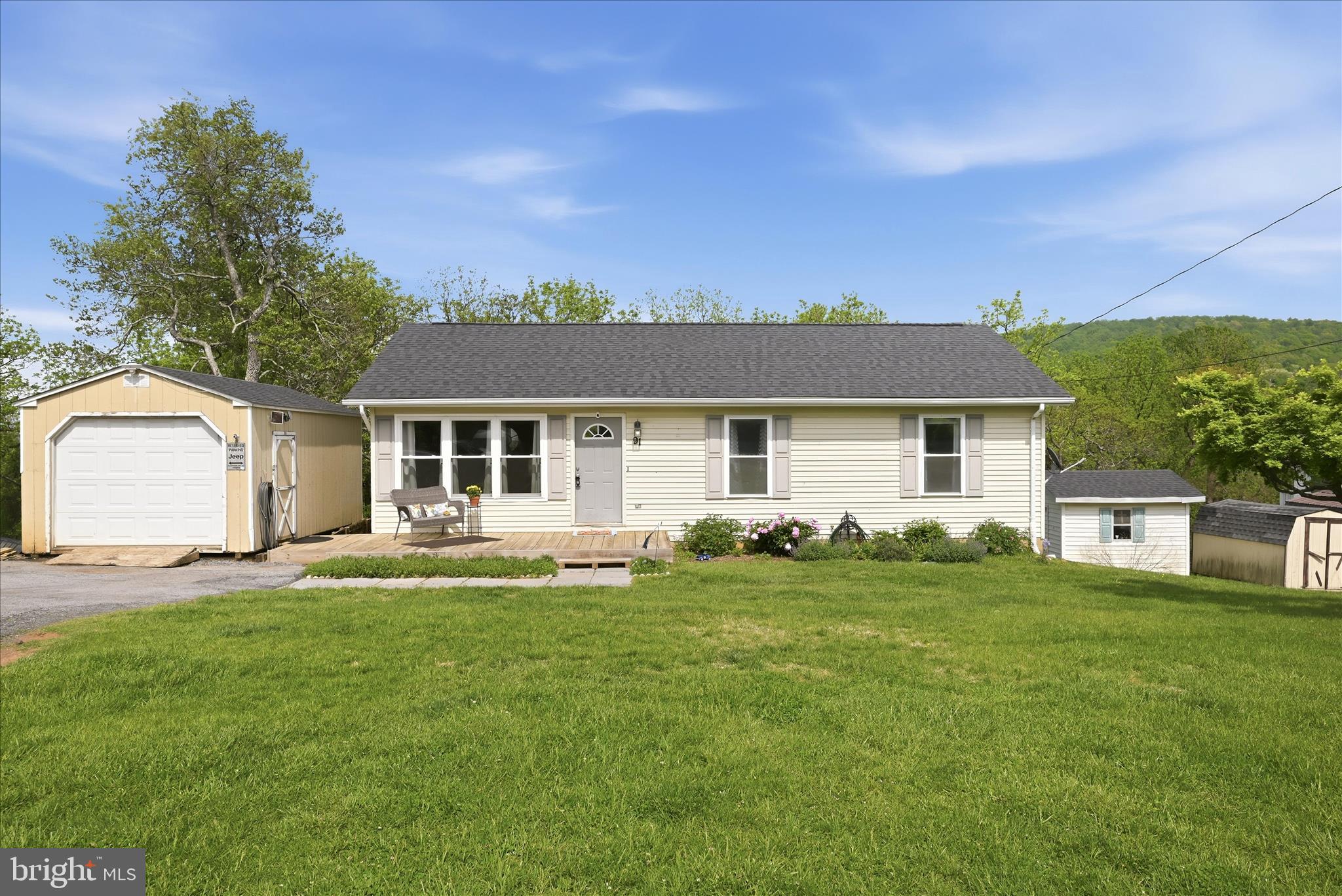 91 Granny Smith Road Linden, VA 22642 - Photo 58 of 65 a front view of a house with a garden