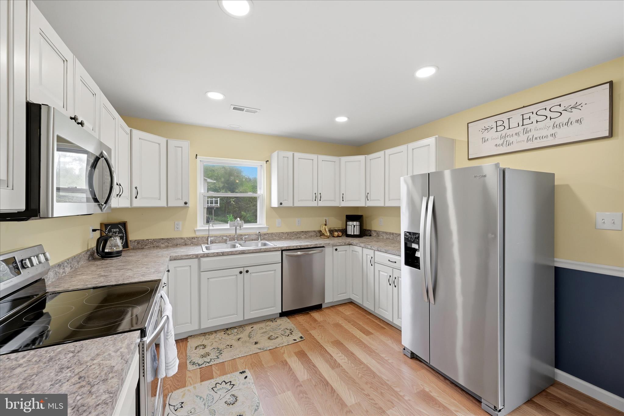 91 Granny Smith Road Linden, VA 22642 - Photo 6 of 65 a kitchen with granite countertop stainless steel appliances a refrigerator sink and microwave