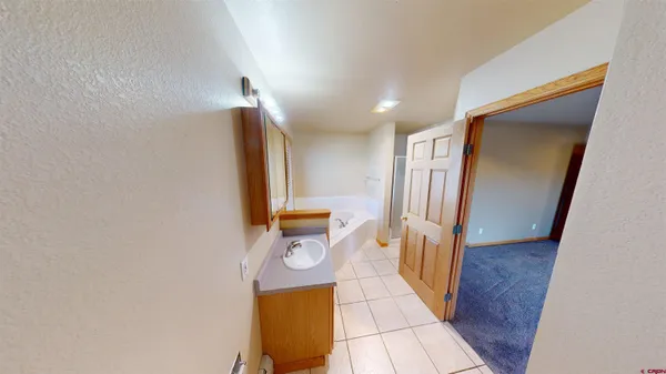 a view of a hallway with washer and dryer