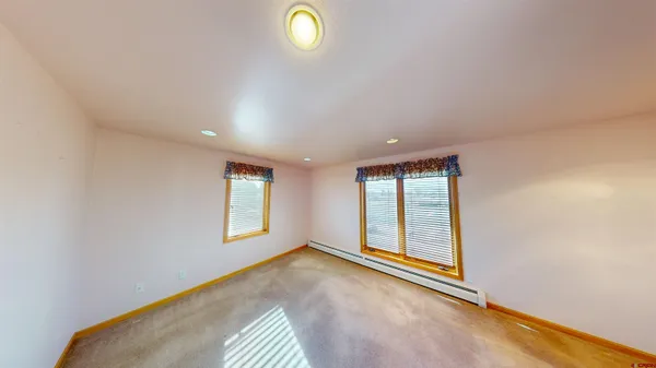 an empty room with windows