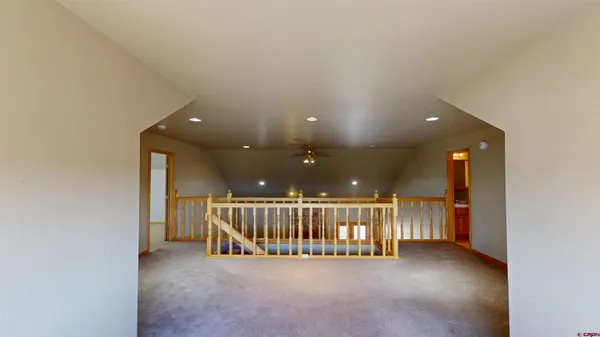 en view interior of a house with stairs and a floor to ceiling window