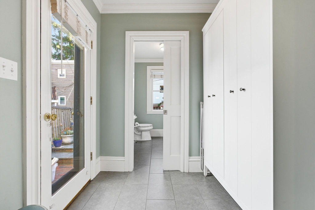 38 Bartlett Street Boston, MA 02129 - Photo 10 of 37 a view of a hallway with a livingroom and a bathroom with sink