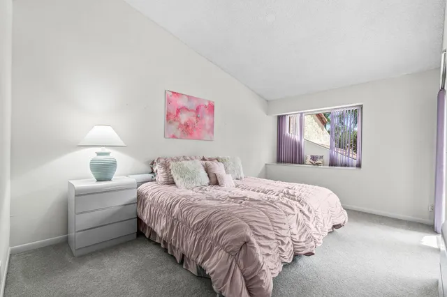 a view of a house with a backyard porch and sitting area