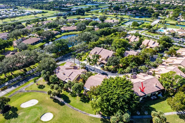 an aerial view of a house with a garden and plants