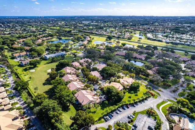 a view of a lake with houses in the back