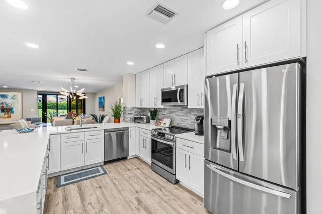 a bed room with a bed and a chair