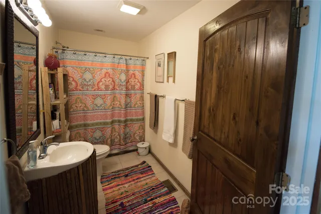 a bathroom with a sink and mirror