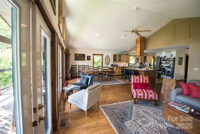 a living room with lots of furniture and a chandelier