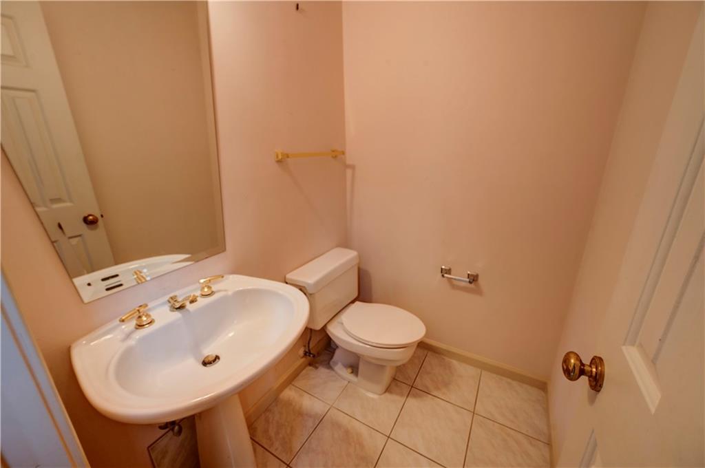 197 Saddlebrook Drive Southeast Calhoun, GA 30701 - Photo 11 of 71 a bathroom with a sink a toilet and a mirror