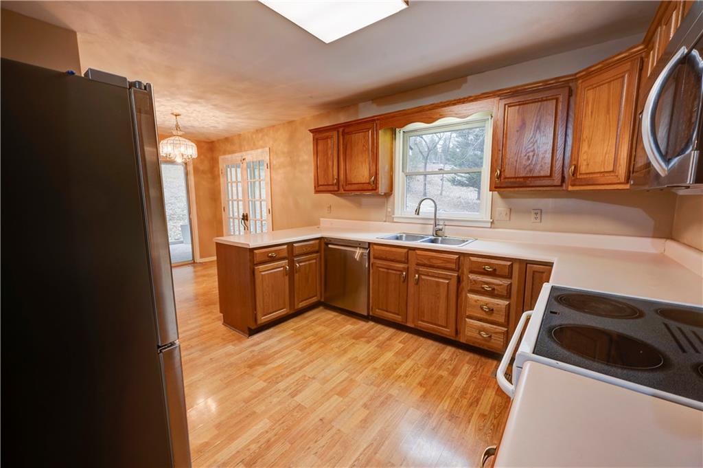 197 Saddlebrook Drive Southeast Calhoun, GA 30701 - Photo 17 of 71 a kitchen with stainless steel appliances granite countertop a sink a stove and refrigerator