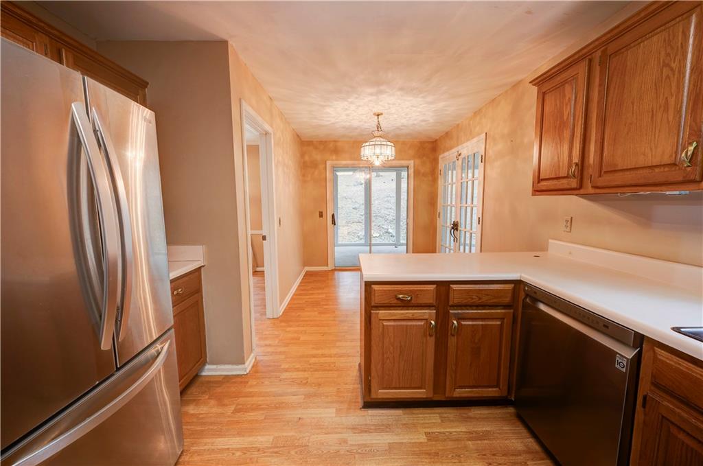 197 Saddlebrook Drive Southeast Calhoun, GA 30701 - Photo 19 of 71 a kitchen with stainless steel appliances granite countertop a refrigerator and a sink