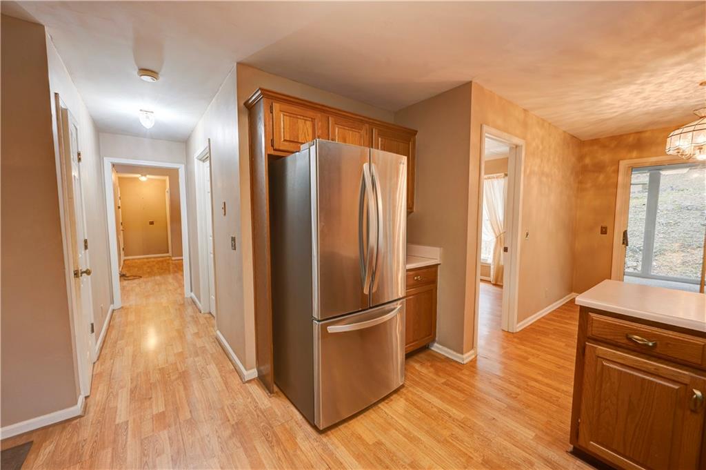 197 Saddlebrook Drive Southeast Calhoun, GA 30701 - Photo 20 of 71 a view of a kitchen with a refrigerator and wooden floor