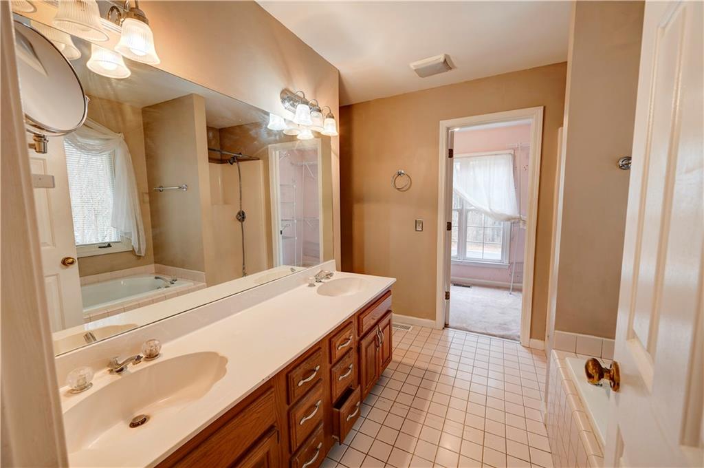 197 Saddlebrook Drive Southeast Calhoun, GA 30701 - Photo 30 of 71 a spacious bathroom with a double vanity sink mirror and