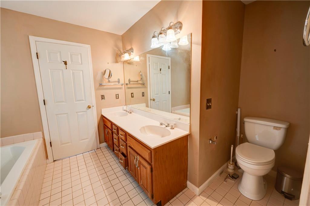 197 Saddlebrook Drive Southeast Calhoun, GA 30701 - Photo 33 of 71 a bathroom with a sink a toilet and shower