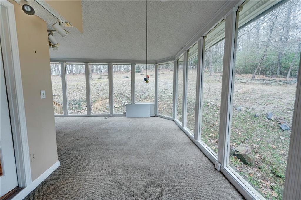 197 Saddlebrook Drive Southeast Calhoun, GA 30701 - Photo 37 of 71 a view of room with window and floor to ceiling window