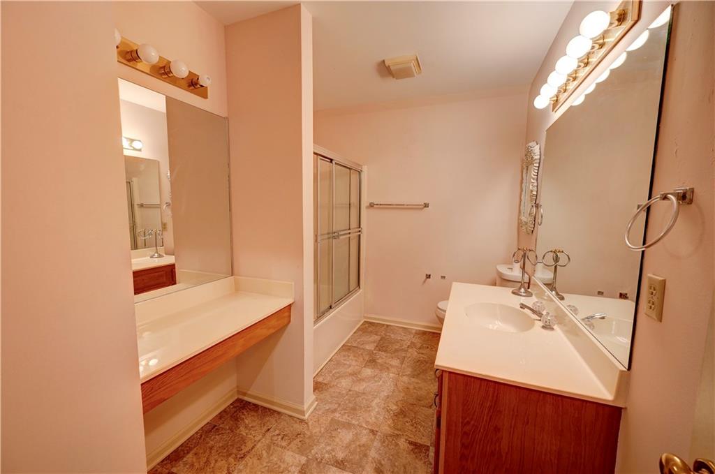 197 Saddlebrook Drive Southeast Calhoun, GA 30701 - Photo 48 of 71 a bathroom with a sink a vanity and a mirror