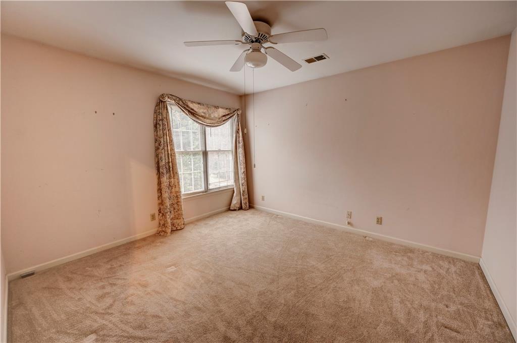 197 Saddlebrook Drive Southeast Calhoun, GA 30701 - Photo 54 of 71 an empty room with windows and ceiling fan