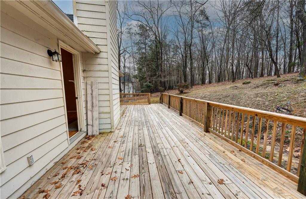 197 Saddlebrook Drive Southeast Calhoun, GA 30701 - Photo 58 of 71 a view of balcony with wooden floor and fence and a pathway