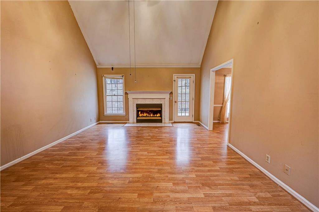 197 Saddlebrook Drive Southeast Calhoun, GA 30701 - Photo 6 of 71 a view of an empty room with a fireplace and a window